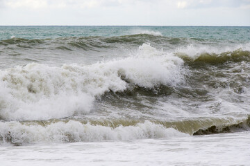Stormy wheater, waves and splashes in Batumi, Georgia. Stormy Black sea.