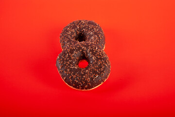 donuts on red background stock photo