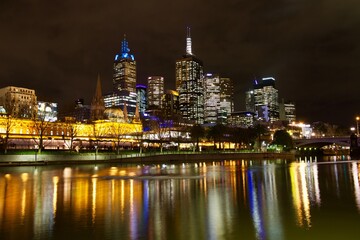 Fototapeta na wymiar Yarra river with skyscrapers reflection at night, Melbourne, Australia 