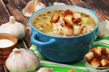 A bowl with traditional Czech garlic soup cesnecka	