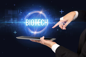 Close-up of a touchscreen with BIOTECH inscription, new technology concept