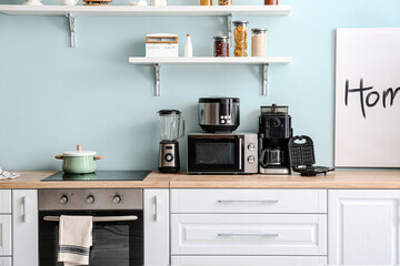 Interior of kitchen with different household appliances