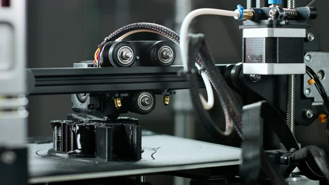 3D plastic printer during work in a factory three dimensional printing.