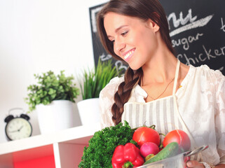 Young woman cooking in the kitchen. Young woman