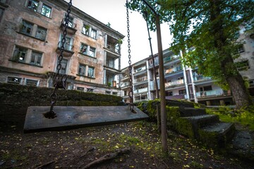 Old wooden swings in abandoned Akarmara town in Abkhazia.