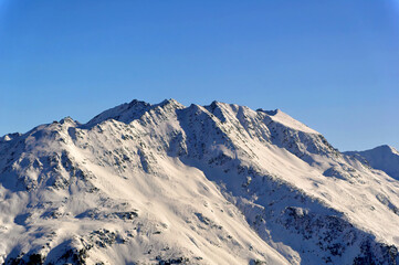 Austrian Alps mountain peaks covered with snow during winter time.