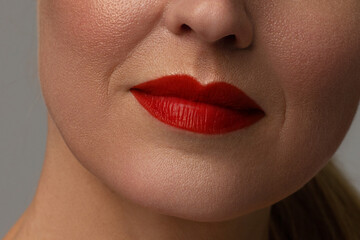 Naklejka premium Close-up of full lips of mature woman with wrinkles. anti aging skin care program. Injections and lifting