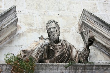statue against a wall, Trogir, Croatia