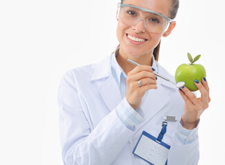 Smiling woman doctor with a green apple. Woman doctor