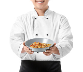 Handsome Asian chef with dish on white background