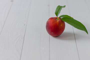 Peach. Fruits with leaves isolated on white background