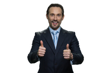 Cheerful man in suit with thumbs up. Well-dressed mature businessman isolated on white background.