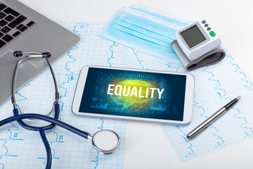 Tablet pc and medical tools with EQUALITY inscription, social distancing concept
