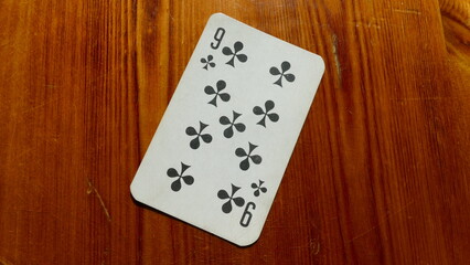 playing card on a wooden background