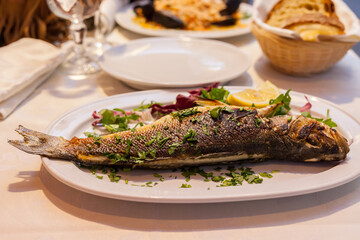 Fried whole fish on a dish.