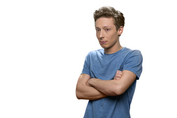 Teen caucasian skinny guy with folded arms. Isolated on white background.