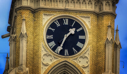 Tower clock at famous catholic Cathedral in Novi Sad, Serbia.
