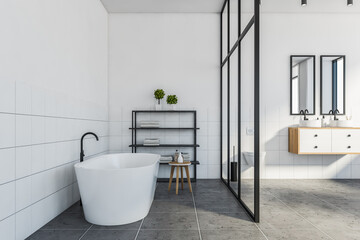 White and black bathroom, tub and sink