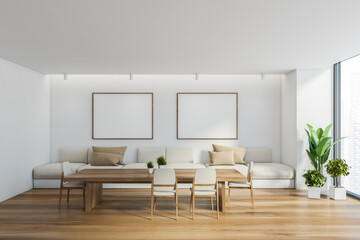 White dining room interior with poster gallery