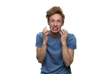 Rage of teenage boy isolated on white. Extremely stressed and angry young guy.