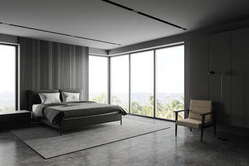 Grey and wooden bedroom corner with armchair