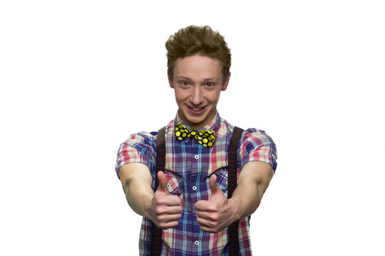 Happy male teenager's showing thumbs up with both hands. Isolated on white background.