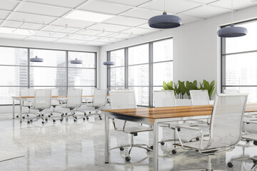 Panoramic white meeting room with two tables