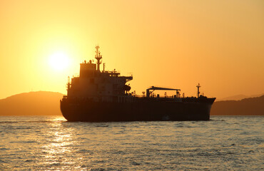  Tanker departs at sunset 