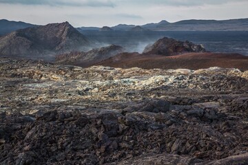 Cooling volcano crater and surface of hardened lava. Iceland.