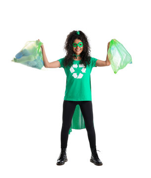 Woman dressed as eco superhero with garbage bags on white background
