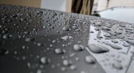 raindrops on the hood of a car