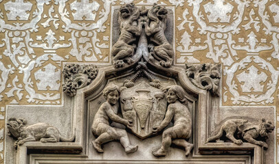 Decorative bas relief composition on the exterior wall of building in Barcelona, Spain.