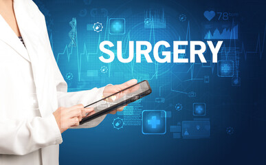 young doctor writing down notes with SURGERY inscription, healthcare concept