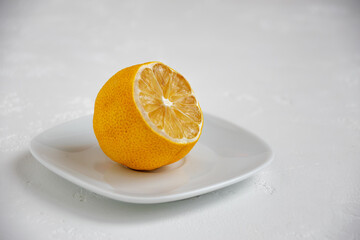 dried lemon on a white plate