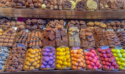 Sweets exposed for sale in La Boqueria market in Barcelona, Spain.