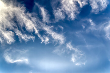 Blue sky with several white clouds at sunny bright day.