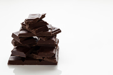 chocolate pieces on white background