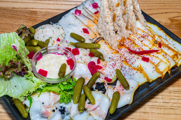 Sala Quartet. Four types of lard. Lard, canned cucumbers, spices, sauce, lettuce