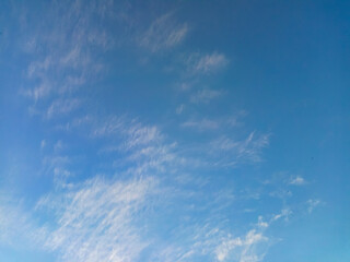 Naklejka na ściany i meble Clear sky with white clouds for a background