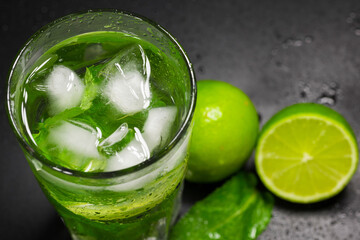 Refreshing lemonade with ice, mint and lime, closeup. Non-alcoholic cocktail.
