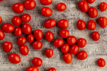 Naklejka na ściany i meble cherry tomatoes on a wooden table