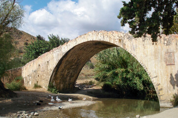 Fototapeta na wymiar Scenic stone footbridge in a remote rural location - Crete