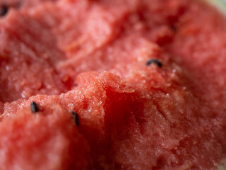 Juicy ripe watermelon in half on a white table