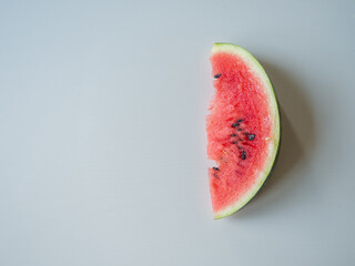 Juicy ripe watermelon in half on a white table