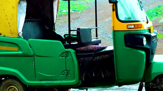 Indian taxi rickshaws exposed in a row.