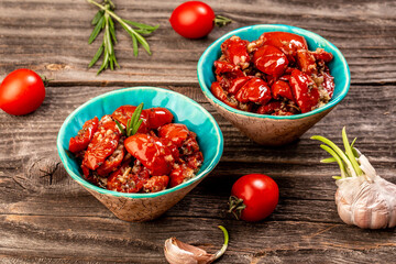 sun dried tomatoes with herbs. reserves vegetables. banner format. space for text