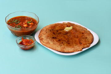 Indian flatbread - Aloo Kulcha with Choley or Stuffed Potato Bread or Stuffed Aloo paratha with tomato ketchup, white chickpeas & pickle - Image