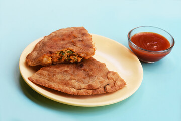 Indian flatbread - Aloo Kulcha with Choley or Stuffed Potato Bread or Stuffed Aloo paratha with tomato ketchup, white chickpeas & pickle - Image