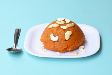 Indian traditional sweet,Plain SemolinaSuji Halwa also known as Sweet Rava Sheera OR Shira - Indian festival sweet garnished with dry fruitsServed in a plate or Bowl,Indian dessert