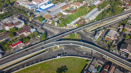 Fototapeta na wymiar Aerial view flyover in Yogyakarta as the road condition is not so dense : YOGYAKARTA, INDONESIA - JULY 19, 2020